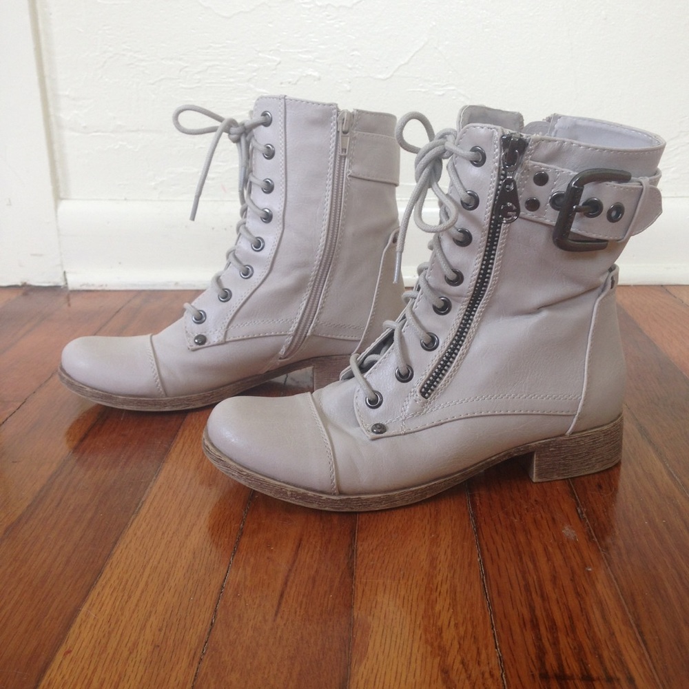 white combat boots with buckle and zipper detail